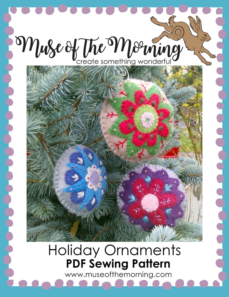 May include: Three felt ornaments with embroidered floral designs in shades of red, green, blue, and purple. The ornaments are hanging on a pine tree branch. The text "Holiday Ornaments PDF Sewing Pattern www.museofthemorning.com" is at the bottom of the image.