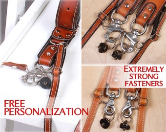 Personalized leather double camera strap with additional accessories & removable cases for batteries / SD flash. Extremely strong fasteners.