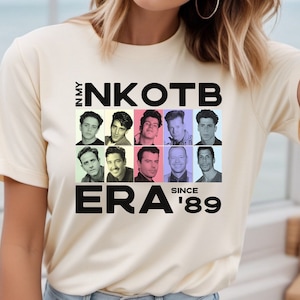 May include: A cream-colored t-shirt with a black graphic that says "In My NKOTB Era '89" with a collage of nine photos of the band members.