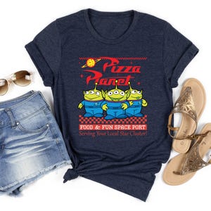 a t - shirt with the words pizza planet on it