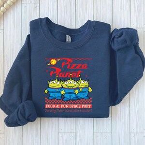 a blue sweatshirt with a cartoon character on it
