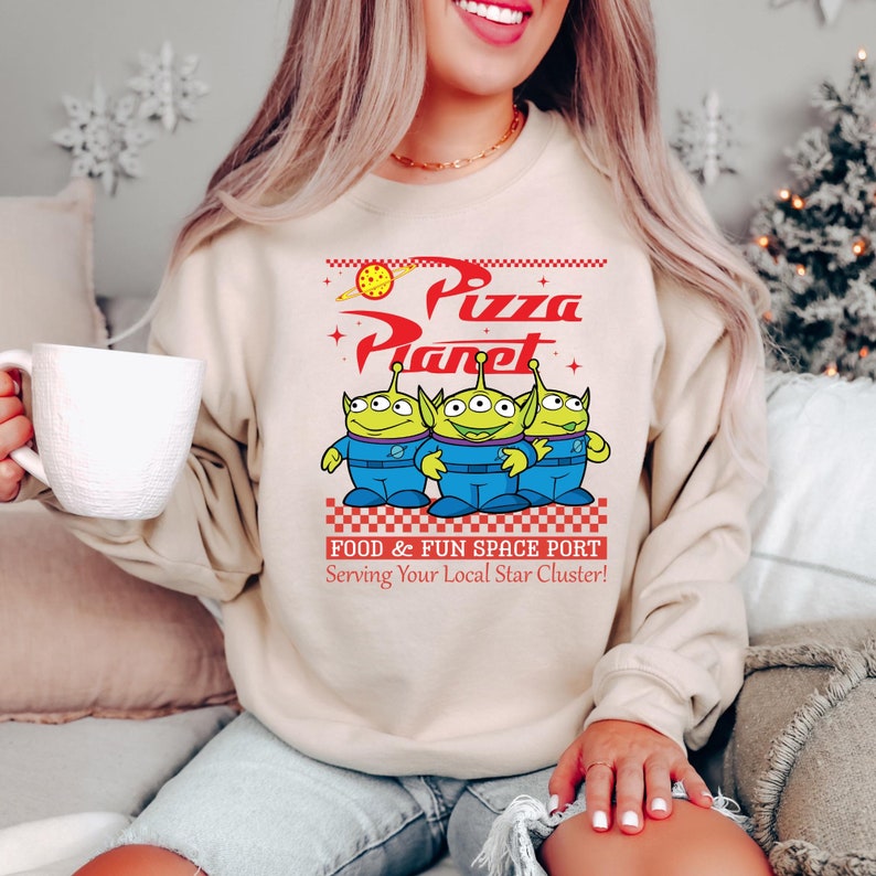 a woman sitting on a couch holding a coffee mug