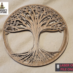 May include: A laser cut wooden tree of life wall art with intricate details. The tree has a thick trunk, branches with leaves, and roots that spread out. The design is circular and has a rustic brown color.