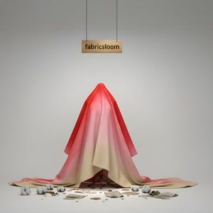 May include: A studio shot features a draped fabric in shades of red, pink, and beige, covering an unseen object. The word "fabricsloom" is displayed on a wooden sign suspended above. Cotton balls and fabric scraps are scattered on the floor.