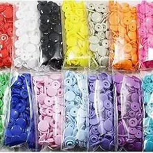 May include: Assortment of 10 packs of plastic snap buttons in various colors, including red, white, black, yellow, beige, orange, green, blue, pink, purple, and light blue.