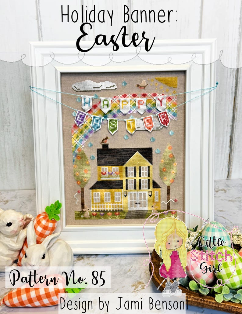 May include: Cross stitch pattern for a house with a banner that reads "Happy Easter". The pattern is framed and there are two white bunnies with orange carrots in the foreground. The pattern is titled "Holiday Banner: Easter" and "Pattern No. 85" and is designed by Jami Benson.