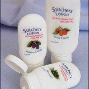 May include: Three white plastic bottles of Sutcher's Lotion, each with a different scent. The bottles are labeled with the scent and the text "Sutcher's Lotion - Non-Alcoholic Moisturizing Cream with Aloe Vera".