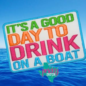 May include: Embroidered patch with the text "IT'S A GOOD DAY TO DRINK ON A BOAT" in green, orange, pink, and blue. The patch has a white background and a blue border, with a Texas-shaped logo.