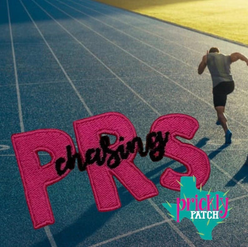 May include: A pink embroidered patch with the text "Chasing PRS" on a blue track with a runner in the background. The patch also features a cactus logo with the words "Prickly Patch".