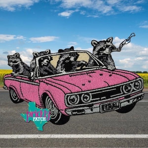 May include: Embroidered patch featuring a pink convertible car with raccoons. The raccoons are driving and smoking. The patch has the word "FERAL" on the license plate and the words "prickly patch" in a teal color.