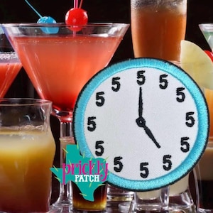 May include: A round, white patch with a light blue border featuring a clock face with the number 5 at each hour. The clock hands point to 5 o'clock. The background includes various cocktails with garnishes.