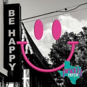 May include: Black and white image featuring a sign that reads "BE HAPPY" in white lettering. A large pink embroidered smiley face is superimposed over the scene. A teal Texas-shaped logo with the words "prickly PATCH" is at the bottom.