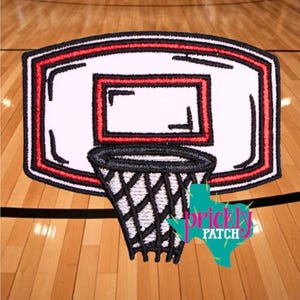 May include: Embroidered basketball hoop patch with a white backboard, red and black trim, and a black net. The patch is in the shape of a rectangle with rounded corners. The logo "Prickly Patch" is in the bottom right corner.