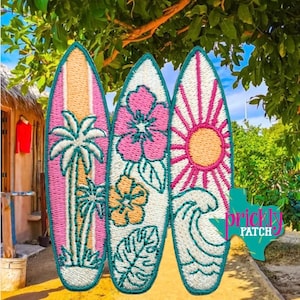 May include: Three surfboard-shaped embroidered patches with teal borders. The left patch features palm trees, the center patch displays pink and yellow hibiscus flowers with leaves, and the right patch shows a sun and ocean wave design.