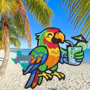 May include: Embroidered patch featuring a colorful parrot holding a tropical drink with a lime wedge and umbrella. The parrot has green, red, yellow, and blue feathers. The background shows a beach scene with palm trees and blue water.