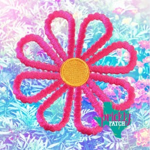 May include: A bright pink embroidered flower with a yellow center. The flower has eight looped petals and is set against a colorful floral background. The image includes the text "prickly patch".