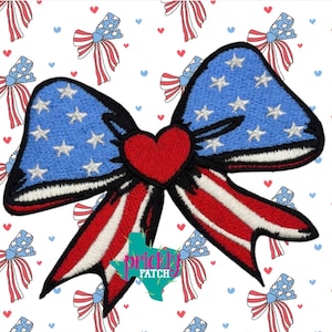 May include: A white ceramic mug with a black handle and the text "But First, Coffee" in a black, bold font. The mug is on a white surface.