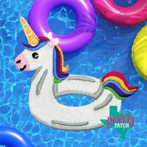 May include: White unicorn-shaped pool float with a yellow horn, rainbow mane and tail, and a pink nose. The float is surrounded by other colorful inflatable rings in a pool. The Prickly Patch logo is visible in the bottom right corner.