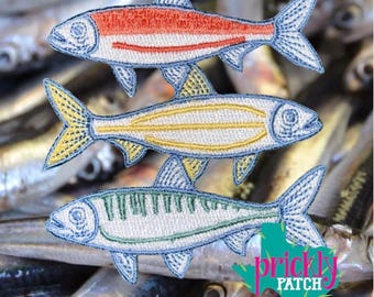 Écusson trio de poissons