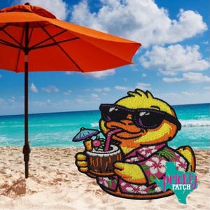 May include: Embroidered patch featuring a yellow duck wearing sunglasses and a Hawaiian shirt, holding a tropical drink with a straw. The duck is on a beach with an orange umbrella and ocean in the background. The patch has the text "prickly PATCH".