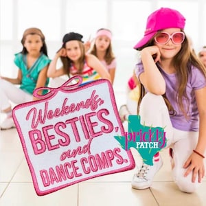 May include: A pink and white embroidered patch with the words "Weekends, BESTIES, and DANCE COMPS." A young girl wearing a pink cap and sunglasses is in the foreground. Other girls are in the background.
