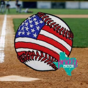 May include: Embroidered baseball patch featuring the American flag design. The baseball is white with red stitching and red and white stripes. The upper left corner displays the blue field with white stars. The patch has the text "Prickly Patch".