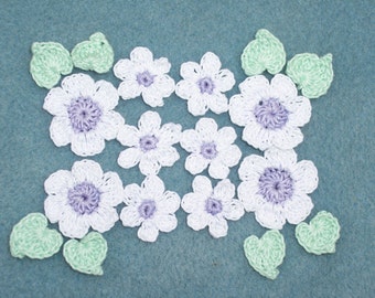 10 purple and white crochet applique flowers with green leaves  --  1036