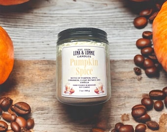 May include: A white candle jar with a black lid and a label that reads "Pumpkin Spice" with notes of pumpkin, spice, cinnamon, clove nutmeg and vanilla. The candle is hand-poured in Missouri and is a soy candle. The jar is 7 oz (198 g).
