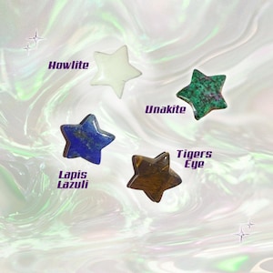 May include: Four star-shaped gemstones: Howlite (white), Unakite (green and pink), Lapis Lazuli (blue), and Tiger's Eye (brown). Each stone is labeled with its name against a swirling, iridescent background.