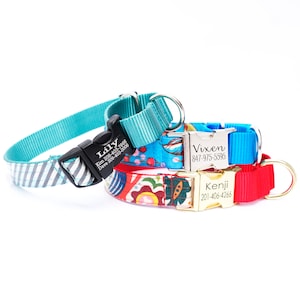 May include: Three personalized dog collars with metal name tags. The collars are turquoise, blue, and red with different patterned fabrics. The name tags are engraved with the names "Lily", "Vixen", and "Kenji" along with phone numbers.
