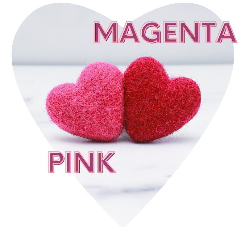 May include: Two felt hearts, one pink and one magenta, on a white marble surface. The word "PINK" is written in pink below the hearts, and the word "MAGENTA" is written in magenta above the hearts.