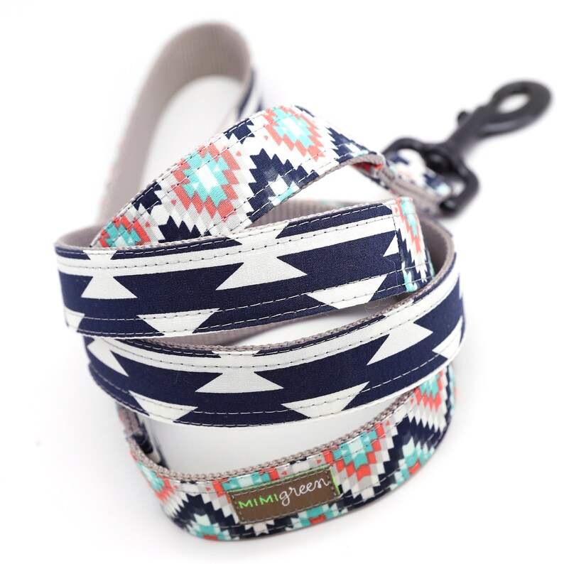 May include: A blue and white patterned dog leash with a geometric design. The leash has a black metal clip and a brown label that says "mimigreen".