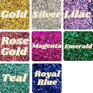 May include: A collection of nine glitter fabric swatches in various colors, including gold, silver, lilac, rose gold, magenta, emerald, teal, and royal blue.