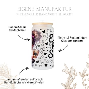 May include: A frosted glass tumbler with a bamboo lid, featuring a design of a woman holding a coffee drink. The design includes black hearts and the text "EKS". The tumbler is handmade in Germany.
