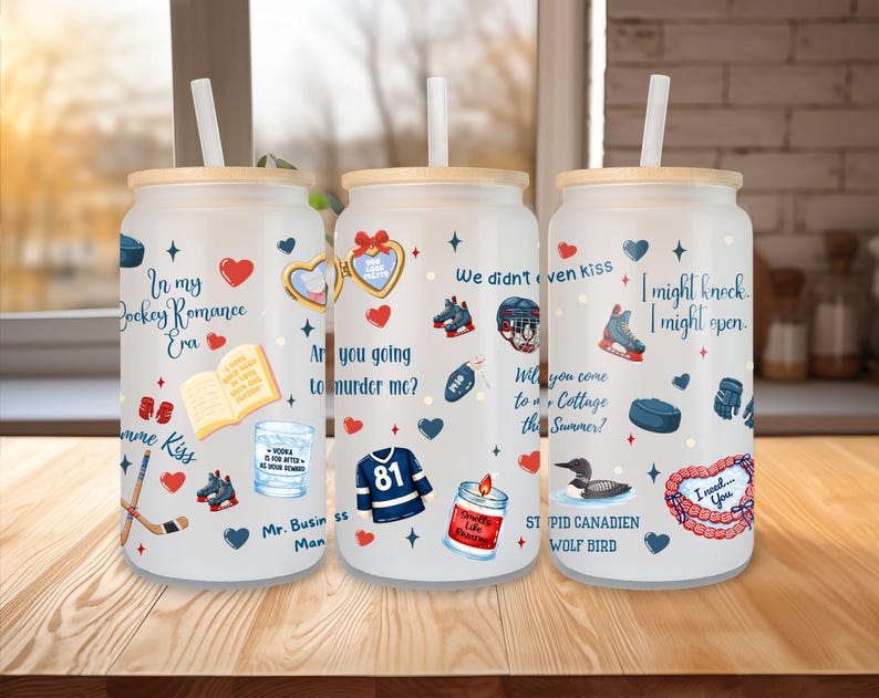 May include: Three glass tumblers with wooden lids and straws, decorated with hockey-themed graphics and text. Designs include hearts, hockey equipment, and phrases like "In my Hockey Romance Era" and "I need you."