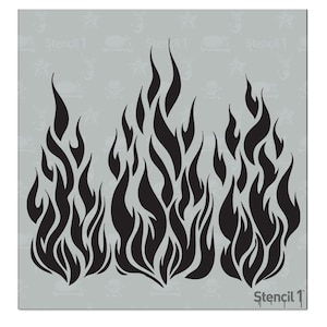 May include: Black flame stencil design on a gray background. The stencil features stylized flames in a repeating pattern. The text "Stencil 1" is visible in the lower right corner. The background has a repeating pattern of stars and skulls.