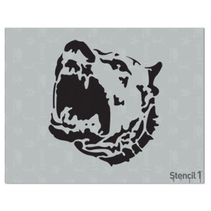 May include: A black stencil of a bear's head on a light gray background. The bear's head is in profile, with its mouth open. The stencil is labeled "Stencil 1" in the bottom right corner.