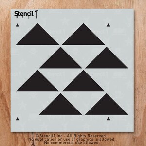 May include: A stencil with a repeating pattern of black triangles arranged in rows. The stencil is light gray with the text "Stencil 1" at the top. Small black triangles are in each corner. The bottom of the stencil has text.
