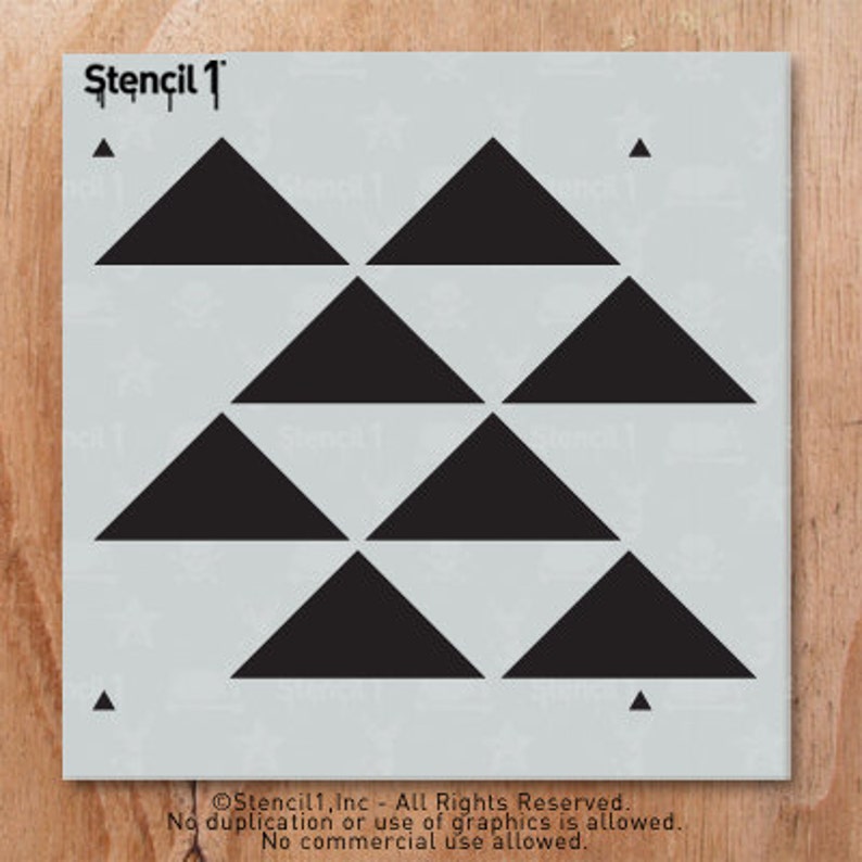 May include: A stencil with a repeating pattern of black triangles arranged in rows. The stencil is light gray with the text "Stencil 1" at the top. Small black triangles are in each corner. The bottom of the stencil has text.