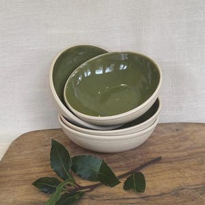 Hand thrown small bowl finished in olive green glaze on the inside