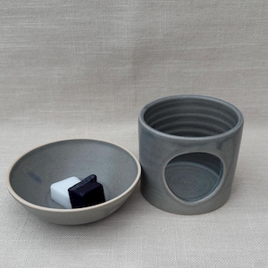 Hand thrown ceramic wax melt / essential oil burner in a soft dusky blue glaze