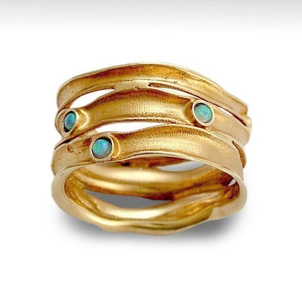 Rolling stones - 14k rose gold band inlaid lab grown opals.