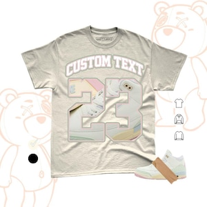 May include: A set of three ceramic canisters with lids, featuring a geometric pattern in shades of blue, white, and gray. The canisters vary in size, suitable for kitchen storage.