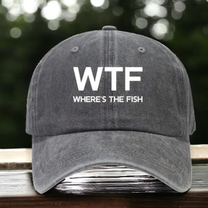 May include: A black baseball cap with the text "WTF WHERE'S THE FISH" in white.