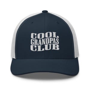 May include: A navy blue and white trucker hat with the text "COOL GRANDPAS CLUB" embroidered in white.