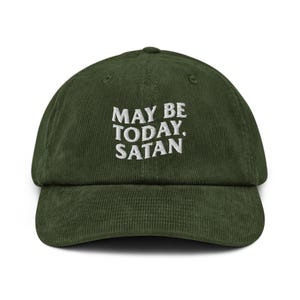 May include: Olive green corduroy baseball cap with the embroidered text "MAY BE TODAY. SATAN" in white. The cap has a curved brim and a structured crown. A casual accessory.