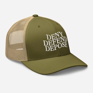 May include: A green and tan trucker hat with the words "DENY DEFEND DEPOSE" embroidered in white on the front.