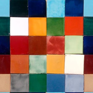 May include: A colorful tiled wall with a pattern of squares in various shades of blue, green, red, orange, brown, and white.