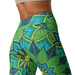 May include: Green, blue, and yellow patterned leggings with a high waist. The leggings feature a floral design with intricate details.