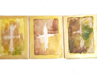 Triptych: three gold crosses. Contemporary painting in watercolor and acrylic